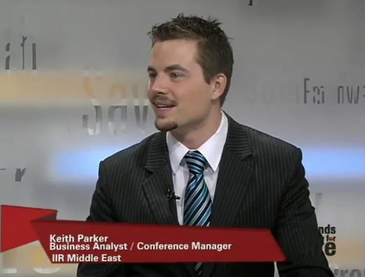 Keith Parker on a television or conference screen during early professional years.