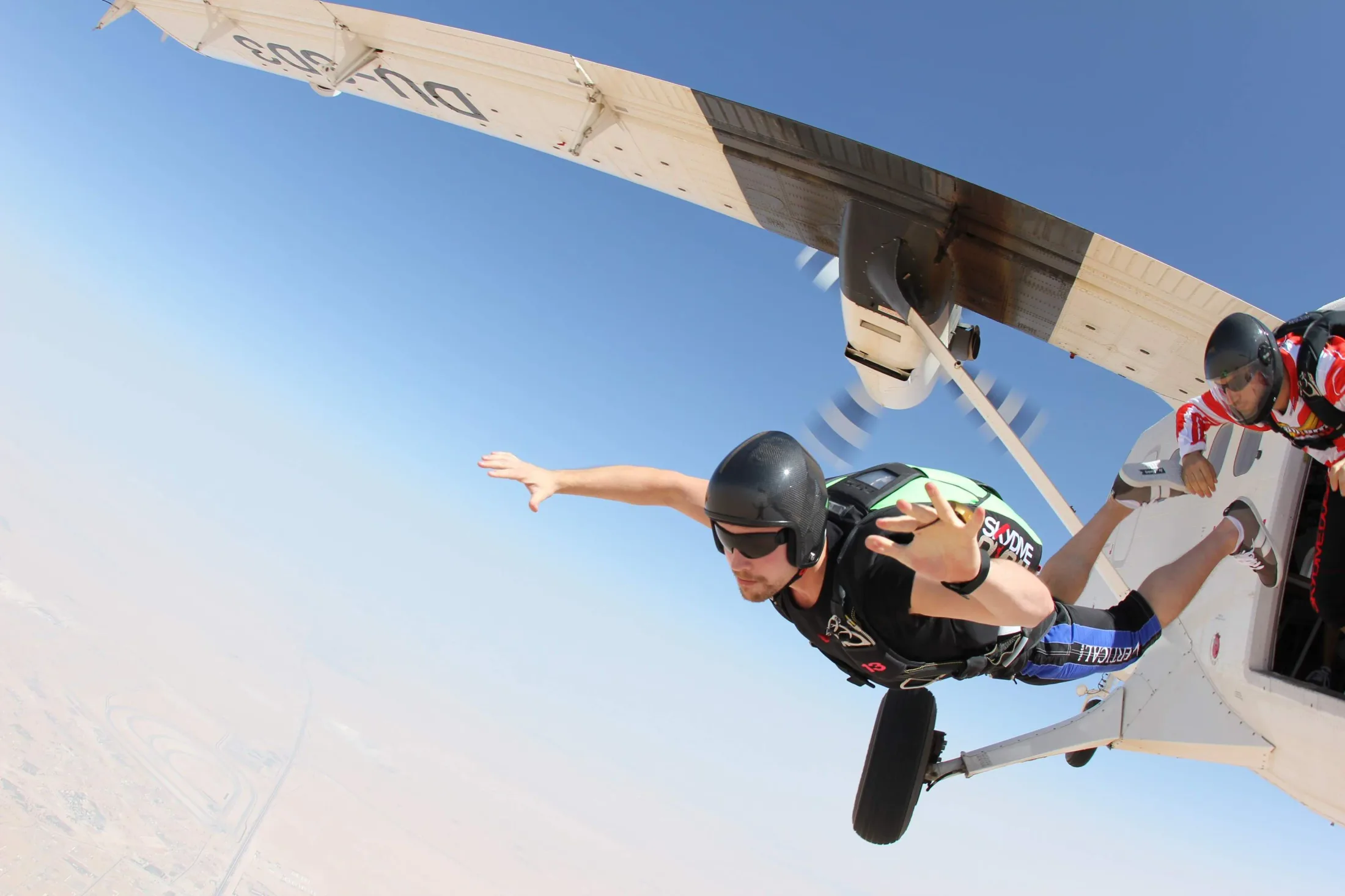 Keith Parker exiting an airplane during a skydive.